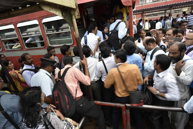 Although the transport department directed MSRTC to operate more buses, but rush due to the strike was huge. People struggle to board a bus at Kurla station (West) on Wednesday. (Arijit Sen/HT PHOTO) Although the transport department directed MSRTC to operate more buses, but rush due to the strike was huge. People struggle to board a bus at Kurla station (West) on Wednesday. (Arijit Sen/HT PHOTO)