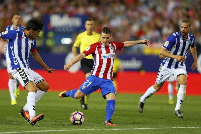 Atletico Madrid's Kevin Gameiro, centre, shoots the ball. (AP Photo)