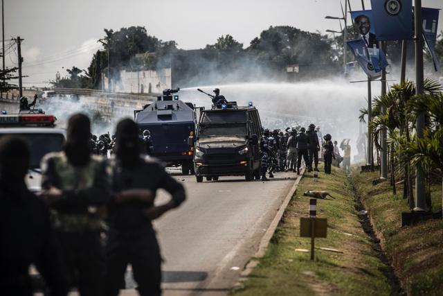 A riot police water cannon is seen spraying supporters of Gabonese opposition leader Jean Ping during clashes in Libreville. (AFP Photo)
