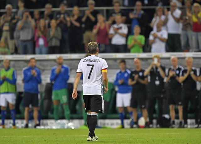 Germany's captain Bastian Schweinsteiger leaves the pitch during their friendly match against Finland. (AP Photo)