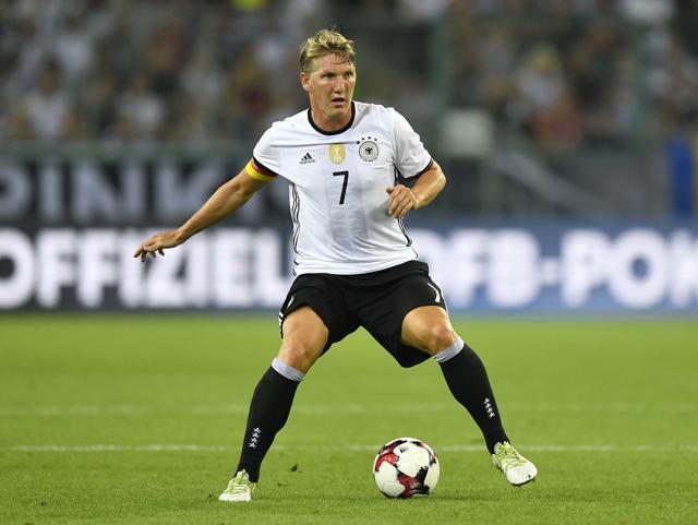 Germany's Bastian Schweinsteiger plays the ball during a friendly match against Finland. (AP Photo)