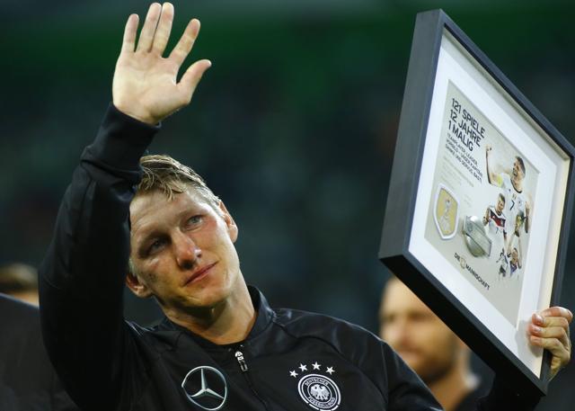 Even before kick-off, with German FA (DFB) president Reinhard Grindel heaping praise on the departing captain during a pre-match presentation, Schweinsteiger struggled to hold back the tears. (Reuters Photo)