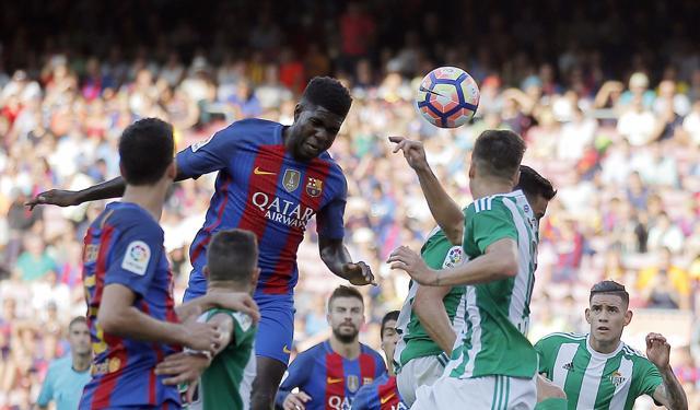 FC Barcelona's Samuel Umtiti, center left, heads for the ball. (AP Photo)