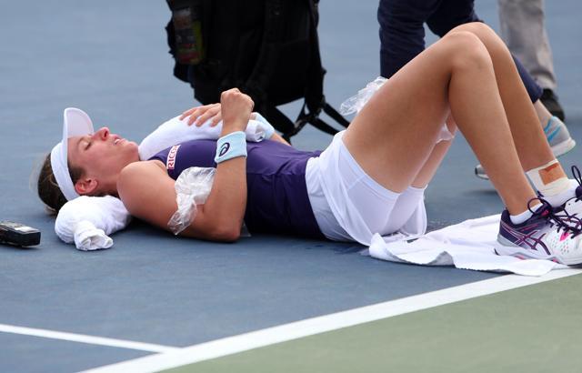 Johanna Konta of Great Britain receives medical attention. (Reuters Photo)