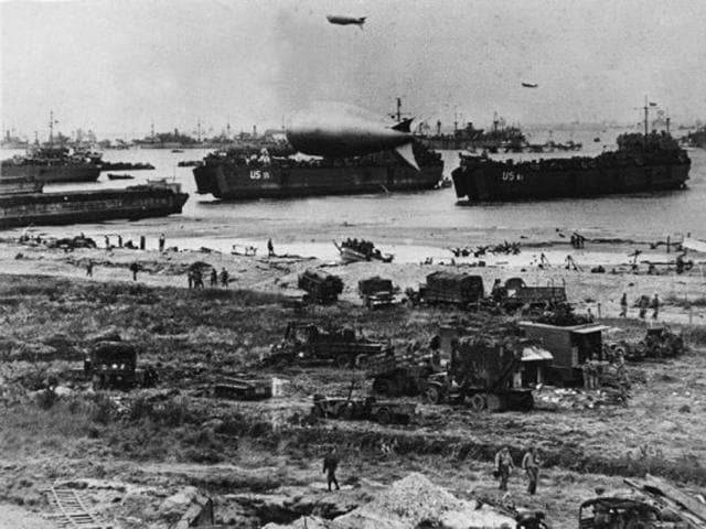 US troops disembark from landing crafts during D-Day (June 6, 1944) after Allied forces stormed the Normandy beaches. D-Day is still one of the world's most gut-wrenching and consequential battles, as the Allied landing in Normandy led to the liberation of France, which marked the turning point in the Western theatre of World War II. (AFP Archive)