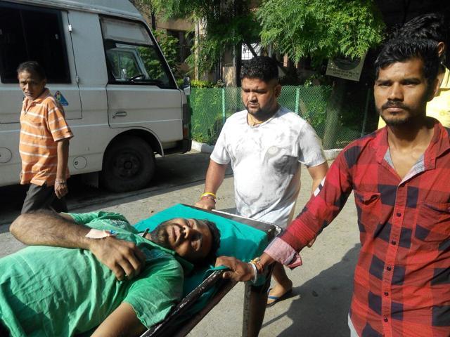 Chander Parkash being taken to the hospital. (HT Photo)