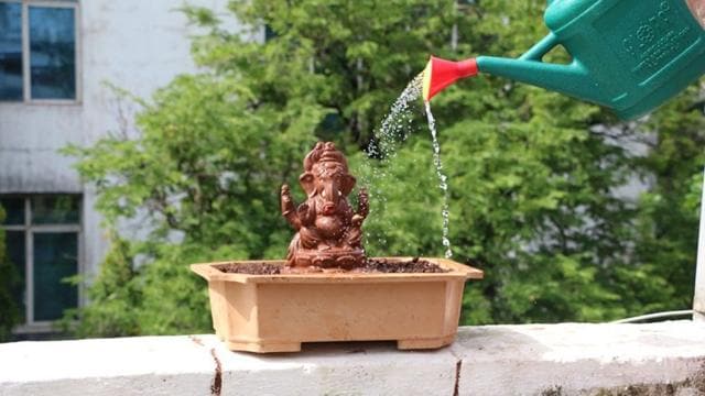 The idol made with red soil, organic fertilisers and shadu clay and filled with holy basil (tulsi) or ladyfinger seeds that will grow into a plant after immersion. (HT Photo) The idol made with red soil, organic fertilisers and shadu clay and filled with holy basil (tulsi) or ladyfinger seeds that will grow into a plant after immersion. (HT Photo)
