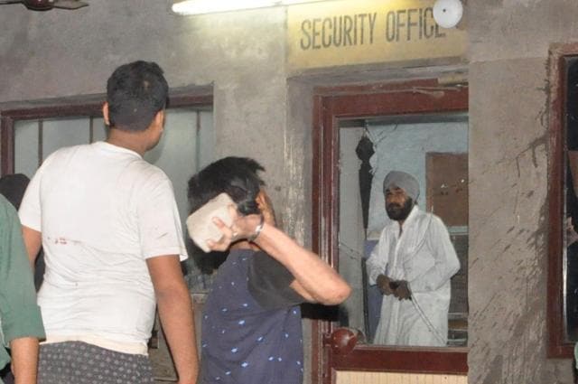 An agitated worker pelting stones on the transporters. (Gurminder Singh/HT Photo)
