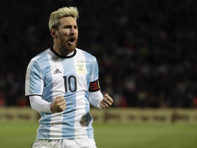 Argentina's Lionel Messi celebrates scoring against Uruguay. (AP Photo)