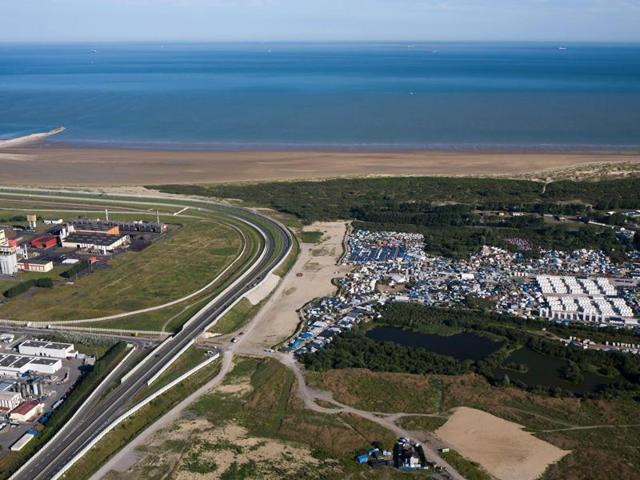 This August 24, 2016 file photo shows an aerial view of the migrant camp, right, in Calais. (AP) This August 24, 2016 file photo shows an aerial view of the migrant camp, right, in Calais. (AP)