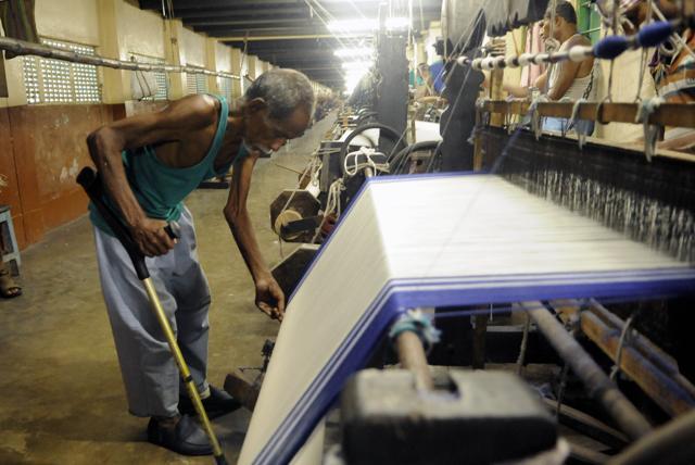 Trademark sarees for the sisters of Missionaries Of Charity are woven at Gandhi Prem Nivas in Titagarh, about 20 kms from Kolkata. Cured leprosy patients work here. (Subhendu Ghosh) Trademark sarees for the sisters of Missionaries Of Charity are woven at Gandhi Prem Nivas in Titagarh, about 20 kms from Kolkata. Cured leprosy patients work here. (Subhendu Ghosh)