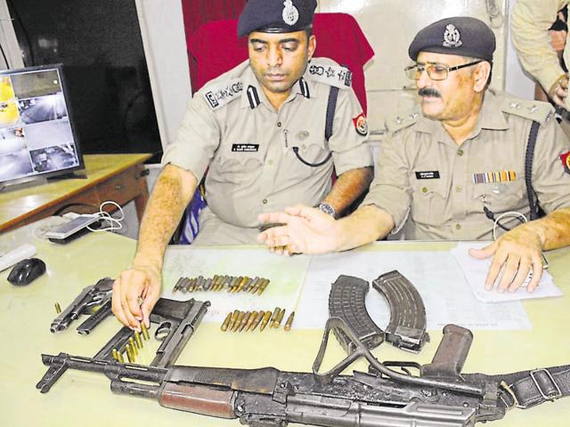 Police display the weapons they recovered from a cricket kit bag that was dumped by the fleeing attackers. (SAKIB ALI/HT FILE) Police display the weapons they recovered from a cricket kit bag that was dumped by the fleeing attackers. (SAKIB ALI/HT FILE)