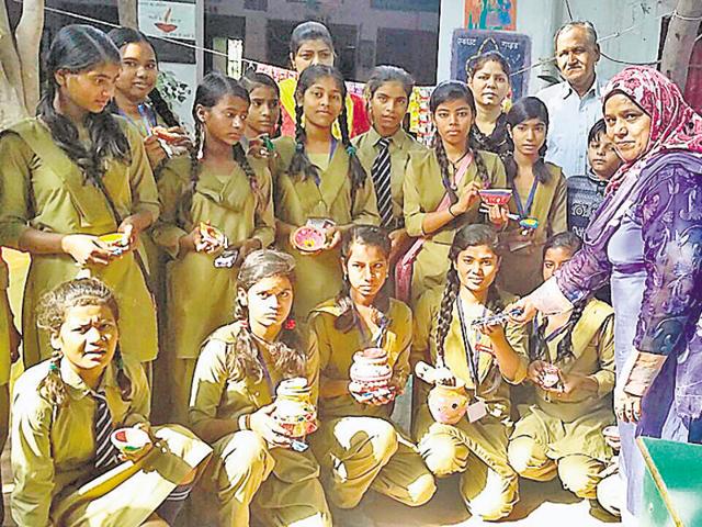 Shadab Qamar (in scarf) with her students. (HT Photo) Shadab Qamar (in scarf) with her students. (HT Photo)