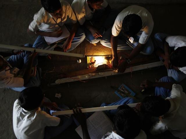 Students learn to fix a tubelight at Hutatma Umaji Naik High School in Bhiwadi village, near Pune, as part of the Lend-A-Hand-India foundation's vocational training programme in Mumbai, India, on Friday, Aug. 31, 2012. (Photo by Vijayananda Gupta / Hindustan Times) (Hindustan Times) Students learn to fix a tubelight at Hutatma Umaji Naik High School in Bhiwadi village, near Pune, as part of the Lend-A-Hand-India foundation's vocational training programme in Mumbai, India, on Friday, Aug. 31, 2012. (Photo by Vijayananda Gupta / Hindustan Times) (Hindustan Times)