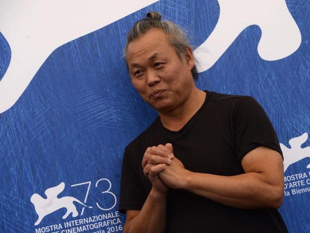Director Kim Ki-duk poses during a photocall of the movie Geumul (The Net) presented out of competition at the 73rd Venice Film Festival. (AFP) Director Kim Ki-duk poses during a photocall of the movie Geumul (The Net) presented out of competition at the 73rd Venice Film Festival. (AFP)