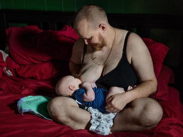 Evan, chest-feeds, a term trans men have adopted for nursing, his newborn son in their Massachusetts home.(Twitter)