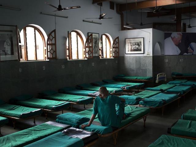 An inmate sits on his bed at Nirmal Hriday, Kalighat, Mother Teresa's home for the dying and destitute in Kolkata. (AP)