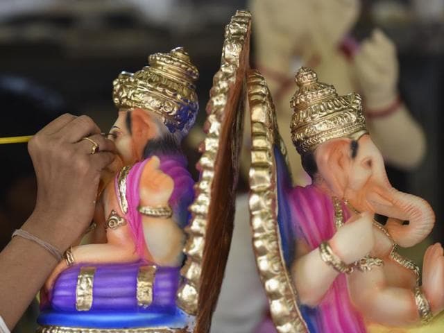 KING OF GODS: An artist works on Ganpati idols. (Kunal Patil/ht ) KING OF GODS: An artist works on Ganpati idols. (Kunal Patil/ht )