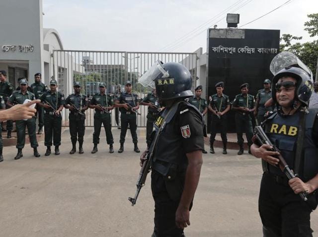 Bangladeshi security personnel stand guard in front of Kashimpur Central Jail where Mir Quashem Ali, a senior leader of the main Islamist party Jamaat-e-Islami, was executed. (AP) Bangladeshi security personnel stand guard in front of Kashimpur Central Jail where Mir Quashem Ali, a senior leader of the main Islamist party Jamaat-e-Islami, was executed. (AP)
