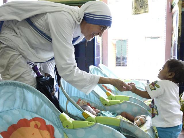 A nun with child at the Nirmala Shishu Bhavan on AJC Bose road in Kolkata. (Samir Jana/HT PHOTO)