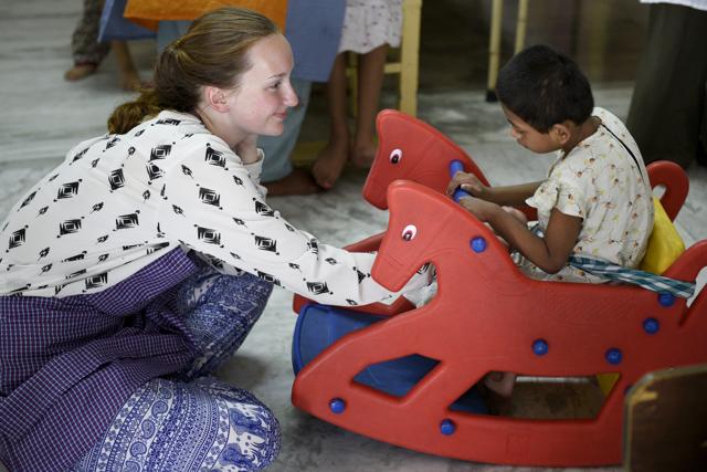 A volunteer plays with a child at Nirmala Shishu Bhavan on AJC Bose road in Kolkata. (Samir Jana/HT PHOTO) A volunteer plays with a child at Nirmala Shishu Bhavan on AJC Bose road in Kolkata. (Samir Jana/HT PHOTO)
