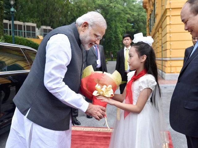 Prime Minister Narendra Modi being welcomed on his arrival at the Presidential Palace, in Hanoi, Vietnam, on Saturday. (PTI Photo)