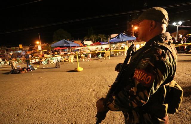 A Philippine soldier keeps watch at the blast site (AP) A Philippine soldier keeps watch at the blast site (AP)