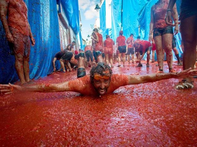 No one really knows the origins of the festival. However, it is popularly believed that disgruntled townspeople rioted and attacked city councilmen with tomatoes during a town celebration. (AFP)