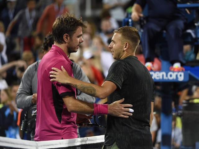 Wawrinka and Evans embrace at the net after the match. (AFP) Wawrinka and Evans embrace at the net after the match. (AFP)