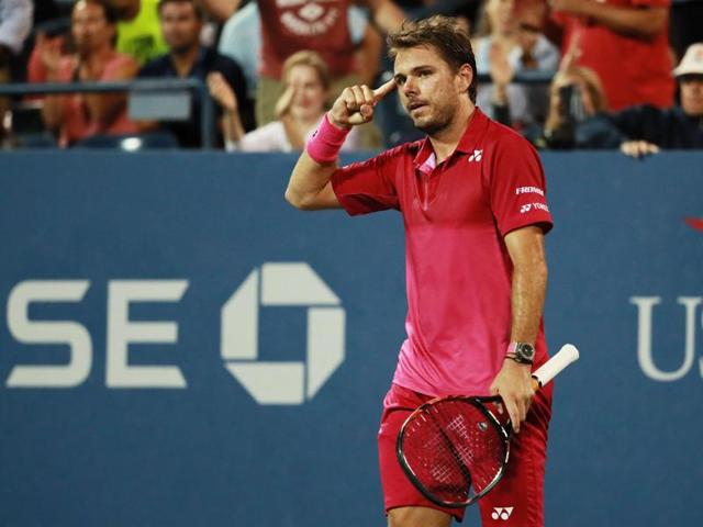 Stan Wawrinka of Switzerland reacts after winning a five-set thriller and saving match point to overcome Daniel Evans of Great Britain. (AFP) Stan Wawrinka of Switzerland reacts after winning a five-set thriller and saving match point to overcome Daniel Evans of Great Britain. (AFP)