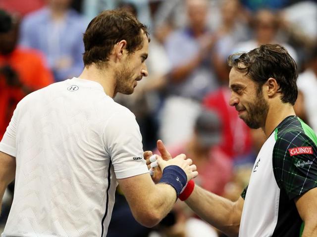 Murray and Lorenzi shake hands at the net after the match. (AFP) Murray and Lorenzi shake hands at the net after the match. (AFP)
