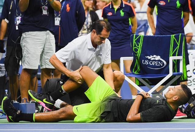 Kyrgios called out the trainer to try and get his hip fixed but it wasn’t enough to complete the match. (AFP) Kyrgios called out the trainer to try and get his hip fixed but it wasn’t enough to complete the match. (AFP)