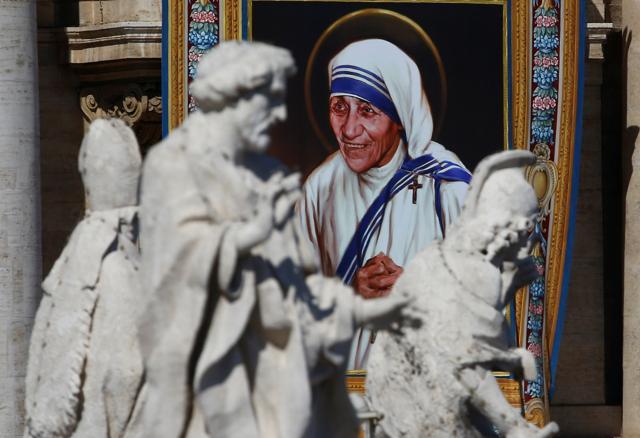 A tapestry depicting Mother Teresa is seen in the facade of Saint Peter's Basilica during a mass, celebrated by Pope Francis, for her canonisation in Saint Peter's Square at the Vatican. (Reuters) A tapestry depicting Mother Teresa is seen in the facade of Saint Peter's Basilica during a mass, celebrated by Pope Francis, for her canonisation in Saint Peter's Square at the Vatican. (Reuters)