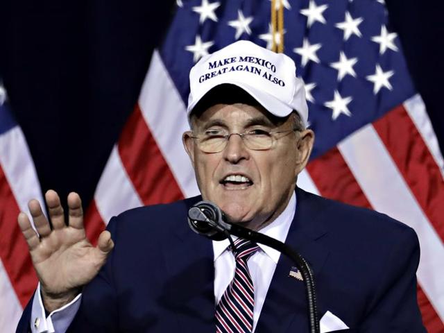 Former mayor of New York City, Rudy Giuliani, wears a "Make Mexico Great Again Also" hat prior to Republican presidential candidate Donald Trump's speech during a rally in Phoenix. (AP File Photo) Former mayor of New York City, Rudy Giuliani, wears a "Make Mexico Great Again Also" hat prior to Republican presidential candidate Donald Trump's speech during a rally in Phoenix. (AP File Photo)