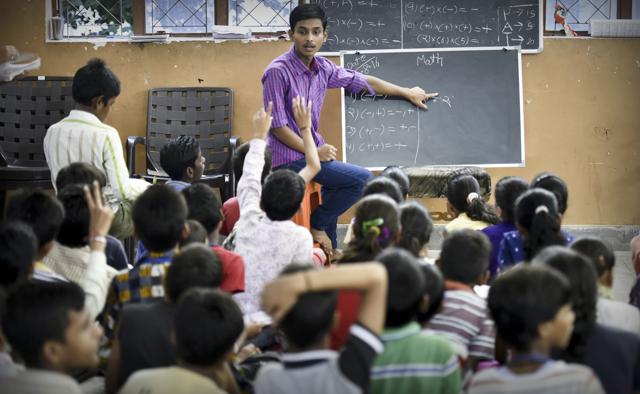 Recent class 12th pass out , 17-year-old Akshay Verma teaches at the Gyan Sandhya School in Pitampura after his shift ends at a garage. (Raj K Raj/HT PHOTO)