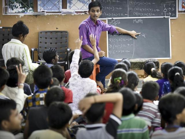 At 9am, 17-year-old Akshay Verma reaches his workplace – a motor mechanic’s garage where he is engaged in unpaid training. At 5pm, however, he reaches Gyan Sandhya School in Pitampura to teach Science and Maths. (Raj K Raj/HT PHOTO)