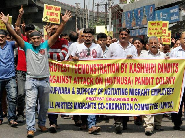 Kashmiri Pandits, along with members of Kashmiri Migrant Employees Association, stage a protest in Jammu. (PTI Photo) Kashmiri Pandits, along with members of Kashmiri Migrant Employees Association, stage a protest in Jammu. (PTI Photo)