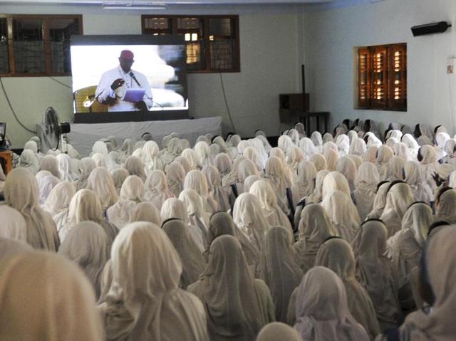 Indian nuns from the Catholic order of the Missionaries of Charity watch a live telecast of the canonisation of Mother Teresa from Rome at The Mother House in Kolkata on Sunday. (Subhankar Chakraborty/HT PHOTO) 