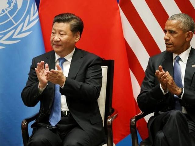 US President Barack Obama and Chinese President Xi Jinping clap as UN Secretary General Ban Ki-moon (not pictured) delivers his speech during a joint ratification of the Paris climate change agreement ahead of the G20 Summit at the West Lake State Guest House in Hangzhou, China.(Reuters Photo)