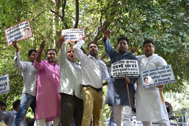 People protest against AAP’s Sandeep Kumar, at the leaders residence in New Delhi on Saturday. (PTI) People protest against AAP’s Sandeep Kumar, at the leaders residence in New Delhi on Saturday. (PTI)