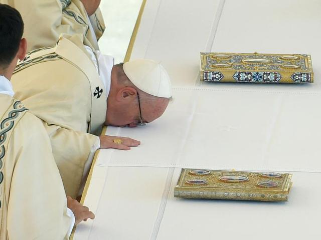 Pope Francis  prays during the canonisation of Mother Teresa. The nun’s whose work with the dying and destitute of Kolkata made her a global icon of Christian charity, was made a saint on Sunday.  (ANDREAS SOLARO/AFP) 