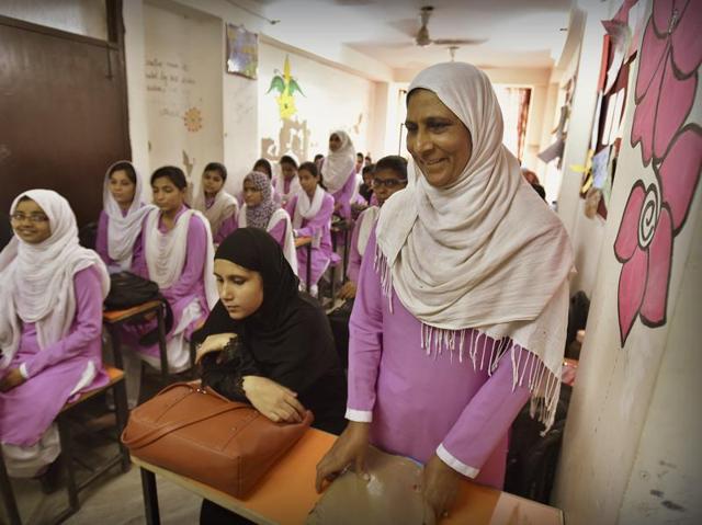 Thirty-nine-year-old Tanzeem Irshad attends a class at Shikhar Girls School in Batla House, which caters primarily to dropouts. The school charges only Rs 900 as registration fee. (Raj K Raj/HT PHOTO)