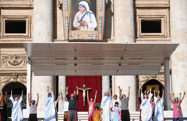 Actors perform as nuns of the Missionary of Charity, the Religious family founded by Mother Teresa at St Peter's square at the Vatican. (AFP)