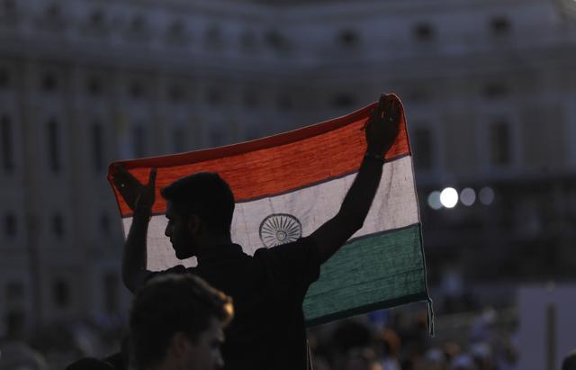 A man holds an Indian flag before the start of a canonisation ceremony in St. Peter's Square at the Vatican. (AP Photo) A man holds an Indian flag before the start of a canonisation ceremony in St. Peter's Square at the Vatican. (AP Photo)