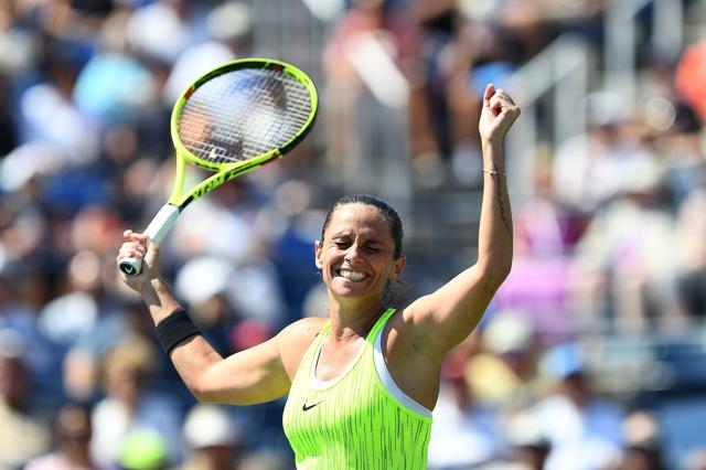 Roberta Vinci of Italy celebrates defeating Lesia Tsurenko of Ukraine. (AFP)