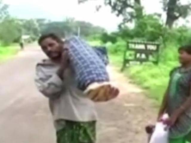 Old video of two men pushing an ambulance which brokedown midway