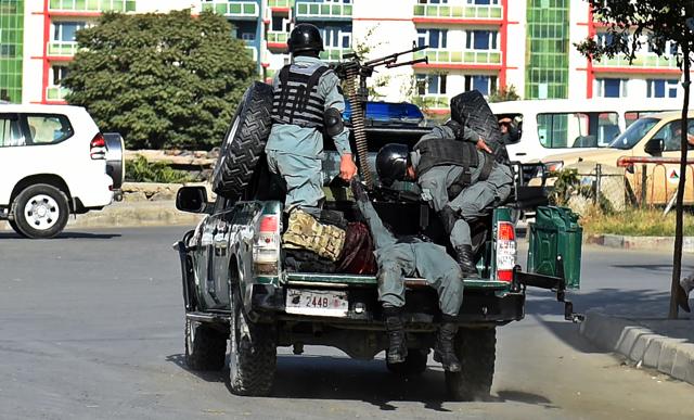Afghan policemen transport wounded colleagues following a twin suicide bombing near the Ministry of Defense in Kabul on Monday. (AFP Photo) Afghan policemen transport wounded colleagues following a twin suicide bombing near the Ministry of Defense in Kabul on Monday. (AFP Photo)