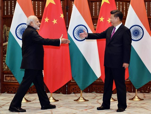 Prime Minister Narendra Modi with Chinese President Xi Jinping before a bilateral meeting in Hangzhou, China on Sunday. (PTI)