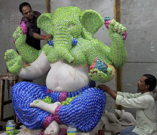 Artists gives finishing touches to the idol of Lord Ganapati made of Mentos Chocolates, ahead of Ganesh festival in Mumbai. (PTI) Artists gives finishing touches to the idol of Lord Ganapati made of Mentos Chocolates, ahead of Ganesh festival in Mumbai. (PTI)