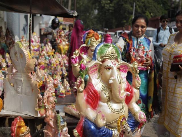 People look to buy idols of Lord Ganesha in Jammu.  (Channi Anand/AP) 